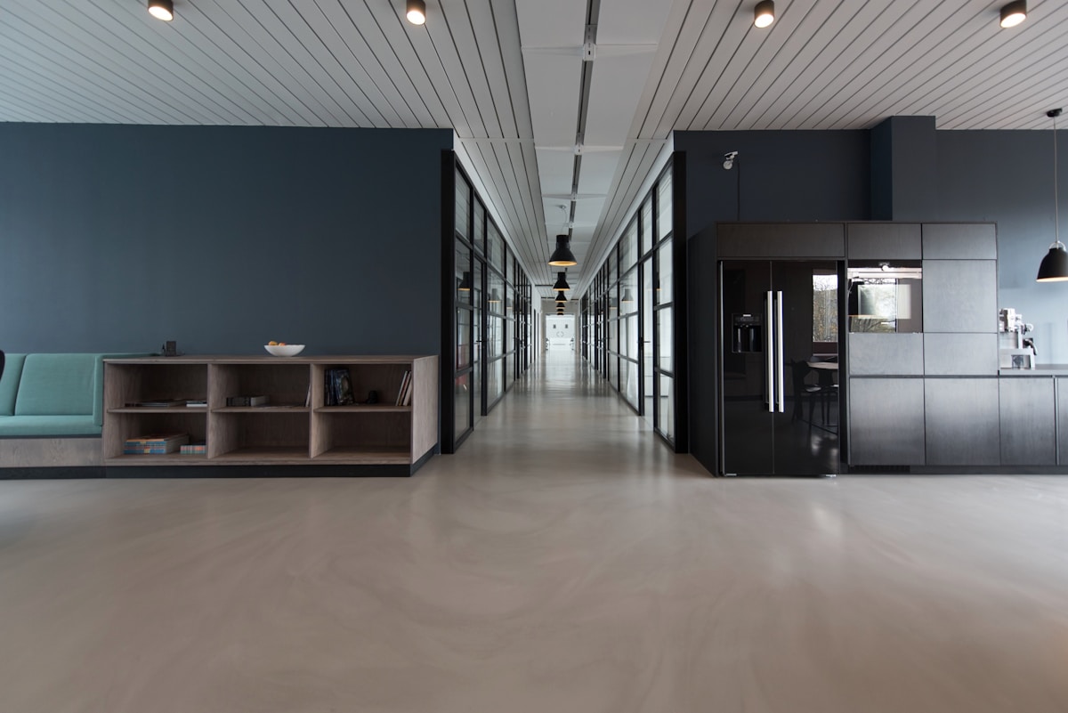 Bright open office with desks and large windows